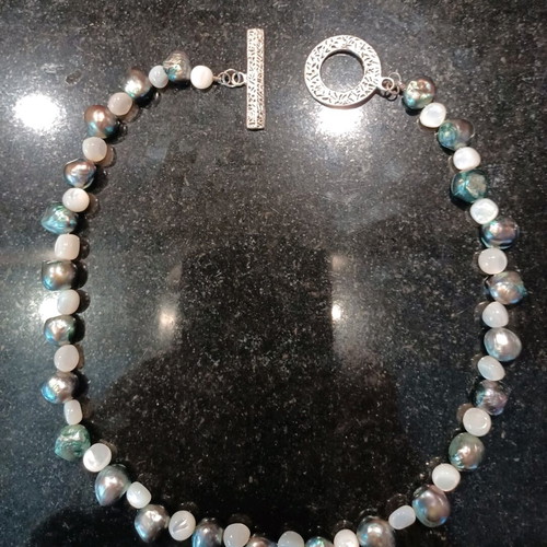 Necklace with white and olive stones, carved clasp, like new