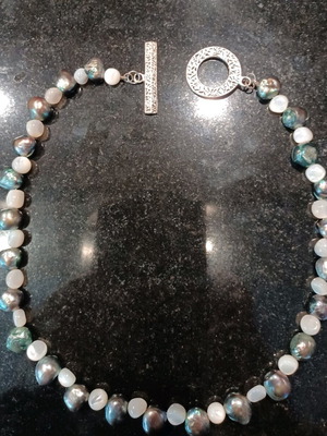 Necklace with white and olive stones, carved clasp, like new