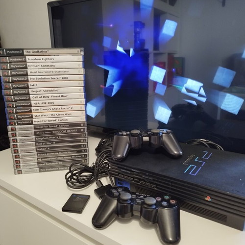 PlayStation 2 Fat console used with 2 controllers, memory card and 21 games