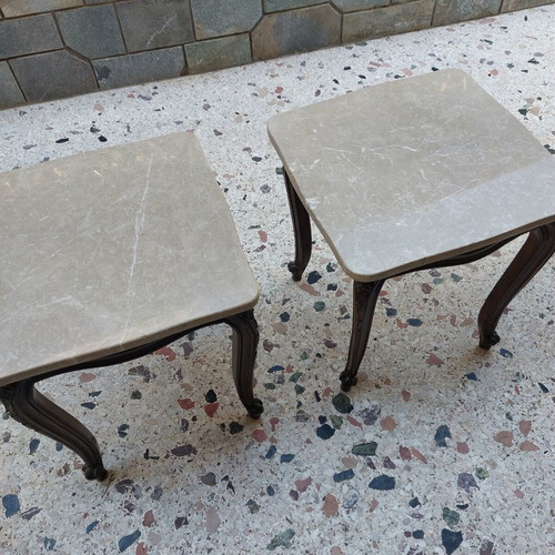 Vintage side tables pair with natural marble used