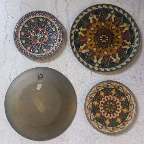 Set of 4 brass hanging plates, 2 large 14.5cm and 2 small 10.5cm