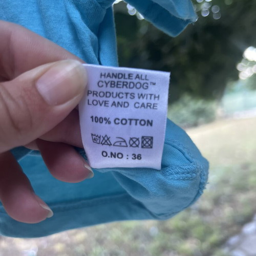 CropTop t-shirt turquoise like new with glow-in-the-dark print
