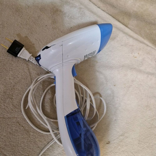 Portable steam device for clothes ironing used