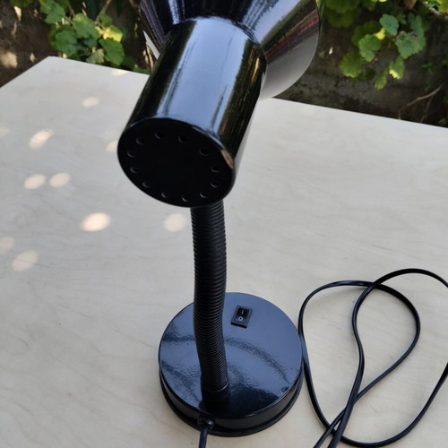 Black table lamp with flexible neck and bulb