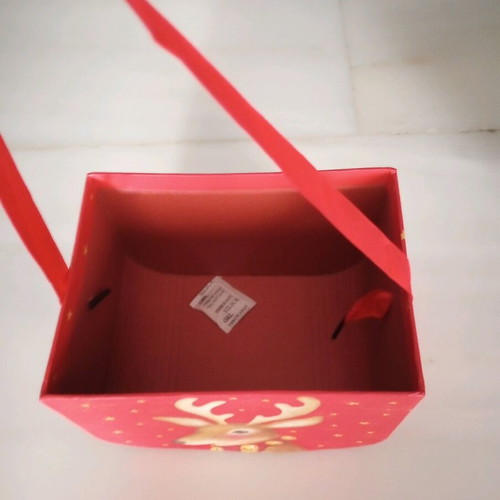Christmas basket new made of pressed paper with ribbon