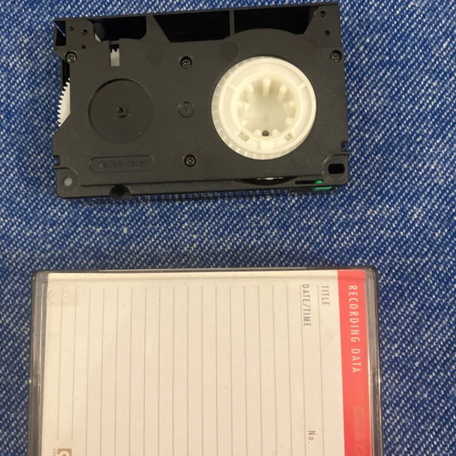 Vintage pack of used floppy disks and cassettes with 8-track and VHS