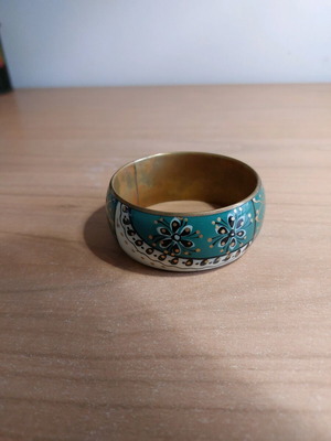 Boho bracelet used with black and green details