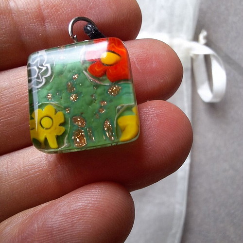 Necklace pendant with green floral design