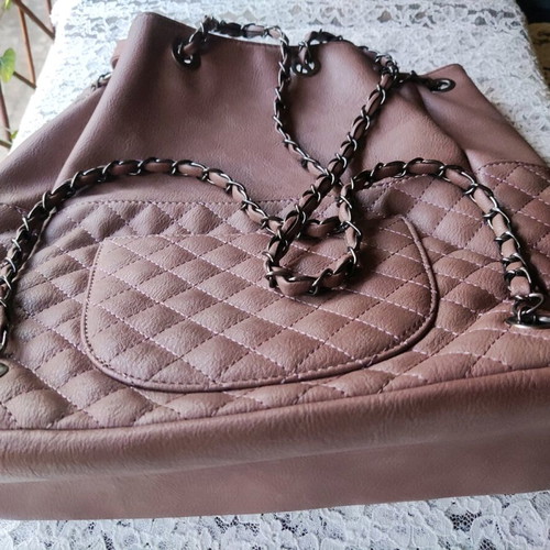 Backpack like new with quilted texture and handles