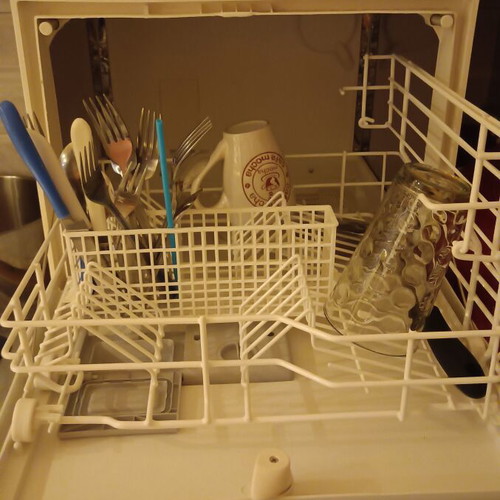 Carad countertop dishwasher used, functional with loose button