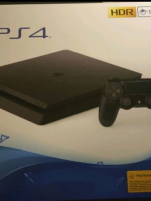 PlayStation 4 Slim 500GB console like new with 1 controller and 3 games