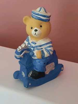 Vintage children's clay piggy bank bear on rocking horse like new