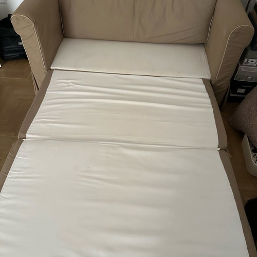 Beige two-seater sofa bed like new with storage space