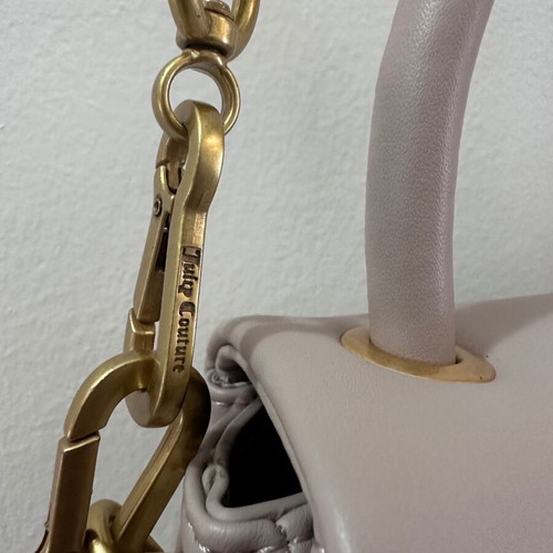 Juicy Couture small crossbody bag nude color with gold design like new