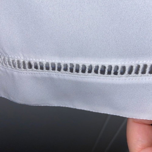 Top white used Danoff one size with perforated details