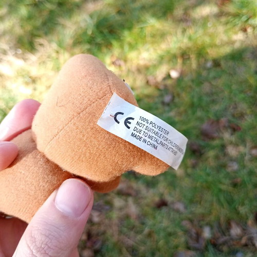 Plush bear keychain used, missing one eye