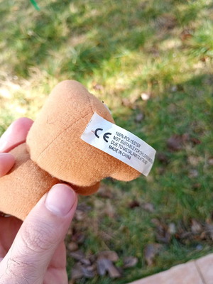Plush bear keychain used, missing one eye