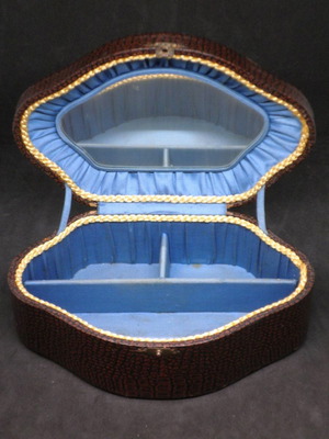 Antique jewelry box used, brown color with blue fabric interior