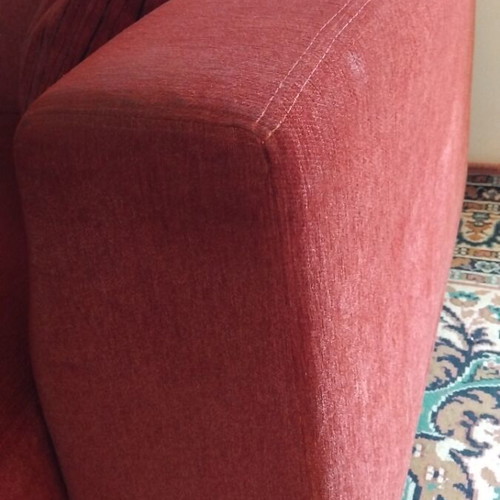 Two-seater sofa used with set of 2 cushions