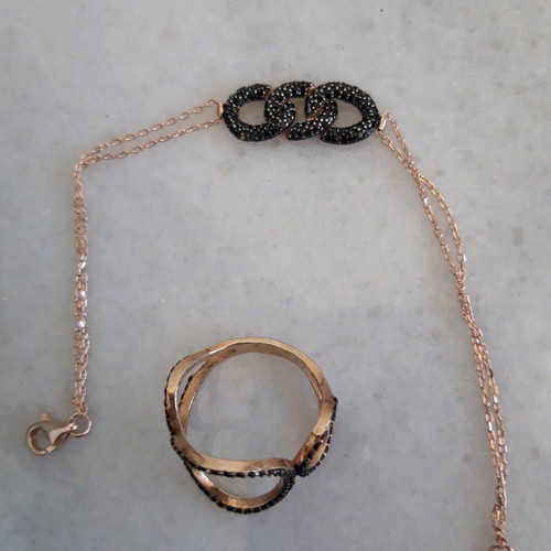 Silver set used with ring and black bracelet