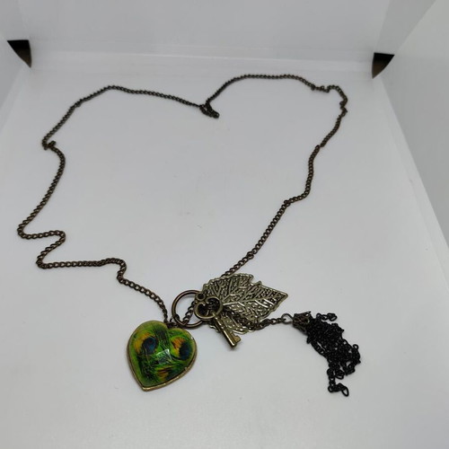 Vintage necklace with antique bronze elements and peacock feather heart pendant like new