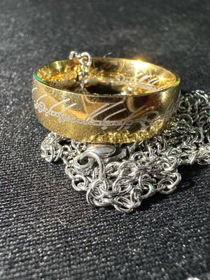Lord of the Rings ring with chain like new, gold and silver