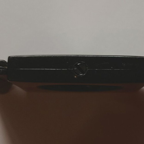 Black plastic cigar cutter used with metal cutting edges