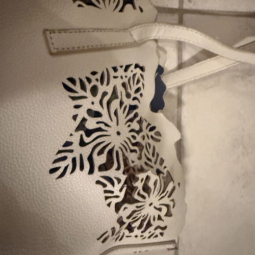 Caprisa shoulder bag used with floral inner pouch, white