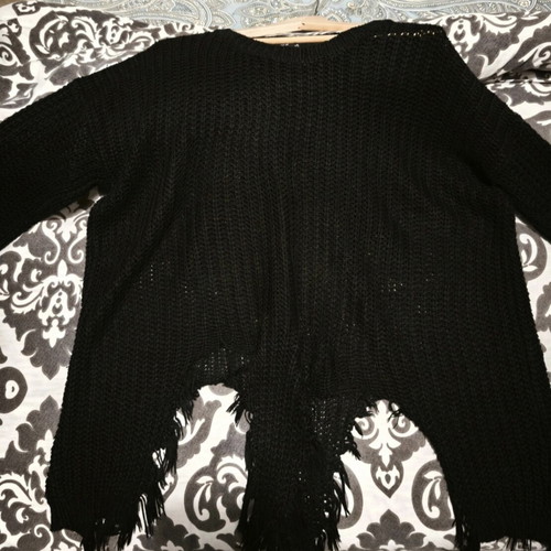 Black knitted sweater with fringes