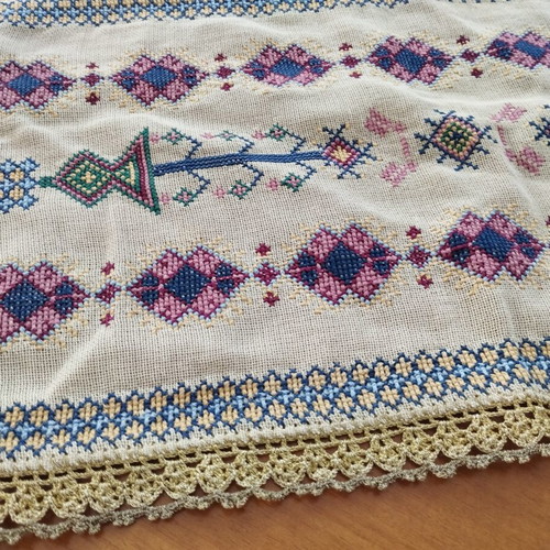 Vintage handmade embroidered table linens with cross-stitch and gold thread
