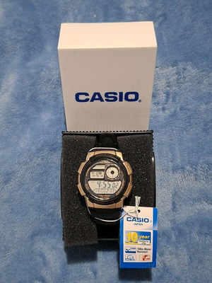 Casio men's watch new, gold