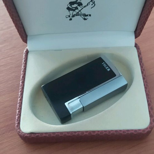 Windproof lighter new in leather-type case, unused