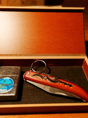 Collectible Zippo lighter 32 years old and handmade Okapi knife.