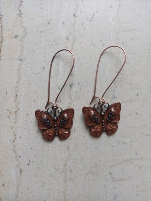 Handmade metal butterfly and skull earrings new, brown