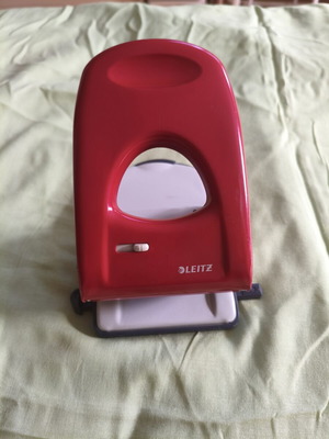 Leitz 5138 heavy duty hole puncher, red handle