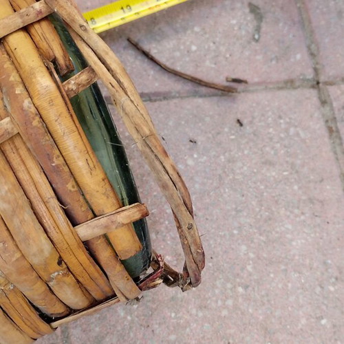 Vintage wicker wrapped demijohn with corncob stopper, used