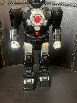 Robot toy used, battery operated, black with movement, light and sound