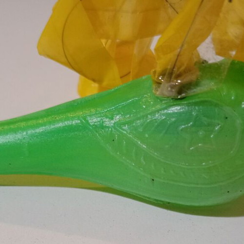 Plastic bird-shaped whistle used, green color