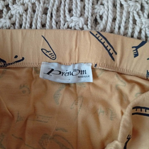 Prénom women's skirt size Small like new, mustard with black line-art