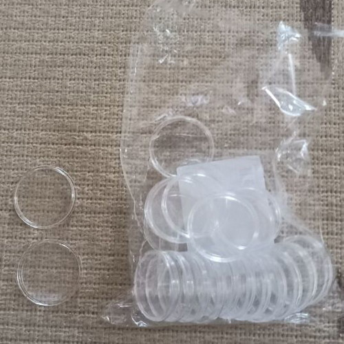 Coin holders new, 20 plastic with 4 cm radius and 9 with 2 cm radius