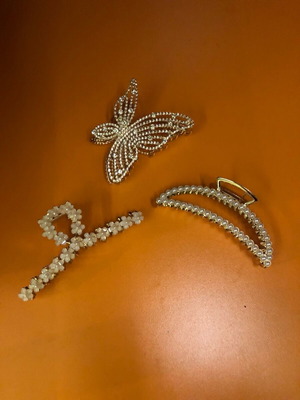 Metal hair clips like new, 3 gold with designs