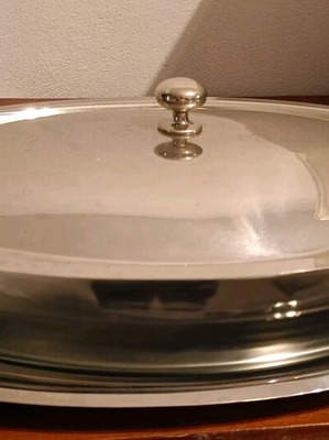 Oval glass heat-resistant dish with lid and tray used