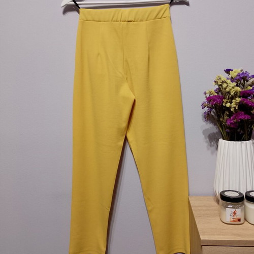 Yellow fabric pants used with elastic waist and pockets