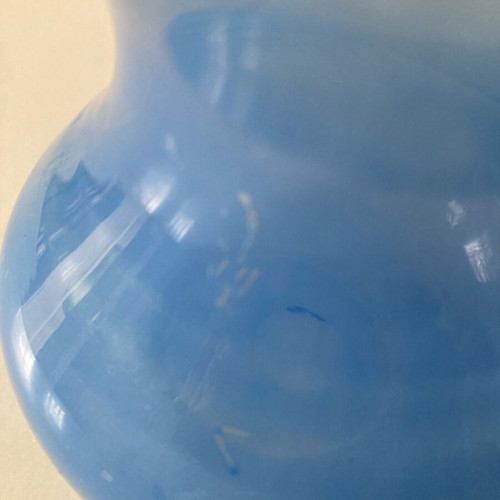 Flower vase used, very thin glass pale blue with wavy opening