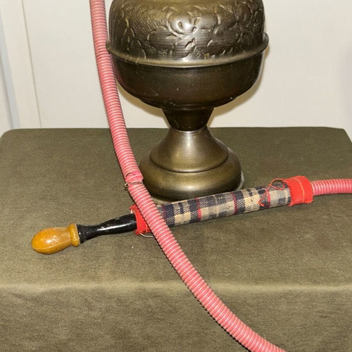 Vintage brass decorative hookah with embossed designs, used