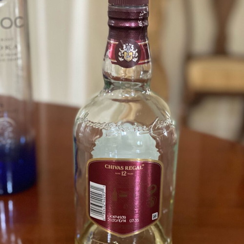 Empty premium liquor bottles and cocktail shaker like new