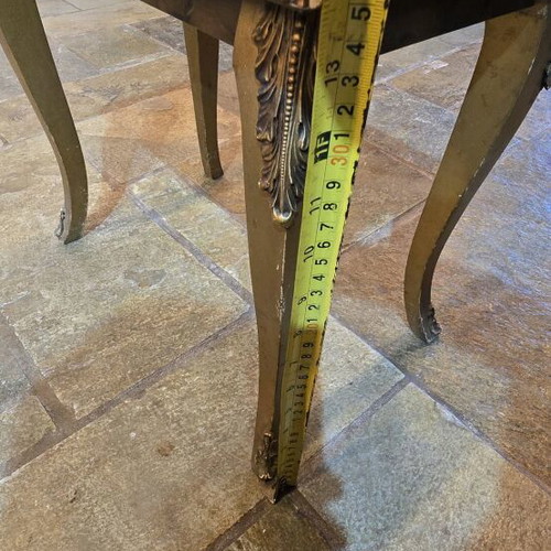 Vintage gold side table used with gilded details