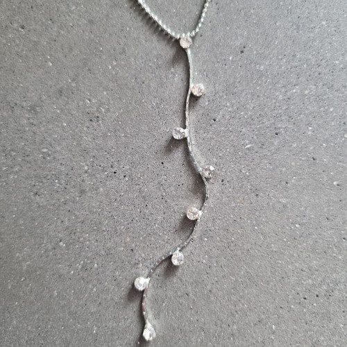 Necklace with hanging chain and stones