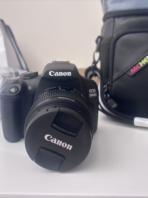 Canon EOS 2000D camera with case and tripod