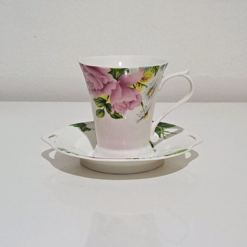 Porcelain cup and saucer set like new